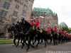 Mounties ride up Parliament Hill to perform the Musical Ride on Canada Day